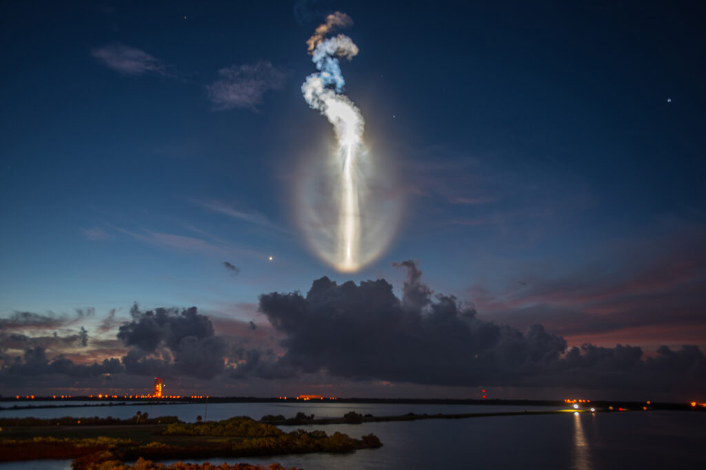 Photo of a delta rocket at dawn breaking through the ice crystals